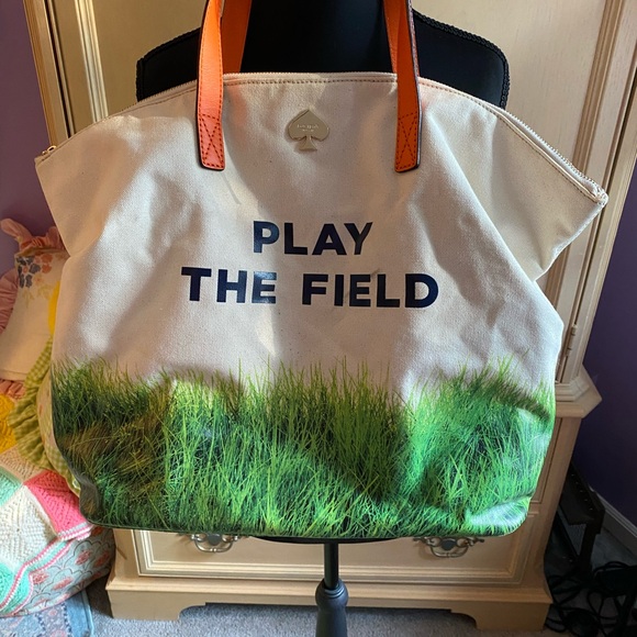 kate spade Handbags - Kate Spade Cream Canvas Tote with Gold Logo